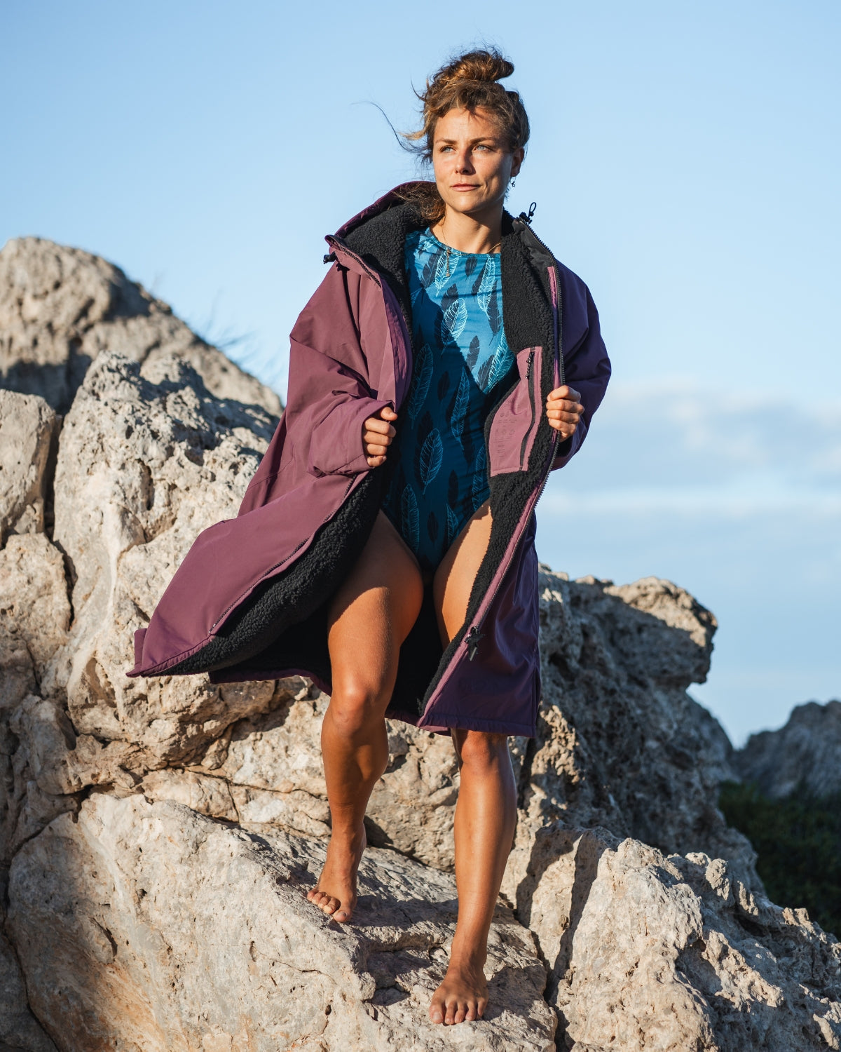 Lead_women - Woman wearing a Vivida sherpa weatherproof changing robe Purple Dusky Damson