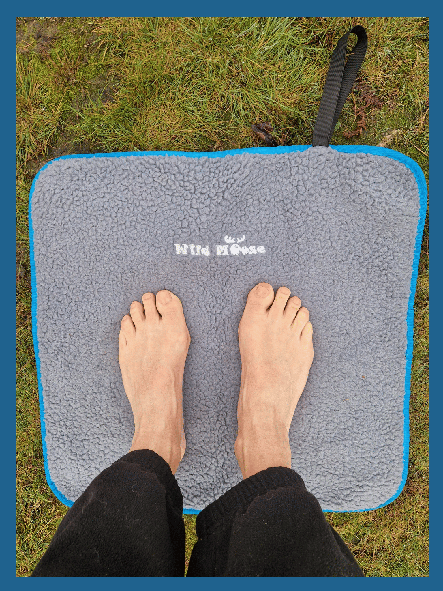 bare feet on a fleece lined changing mat on grass