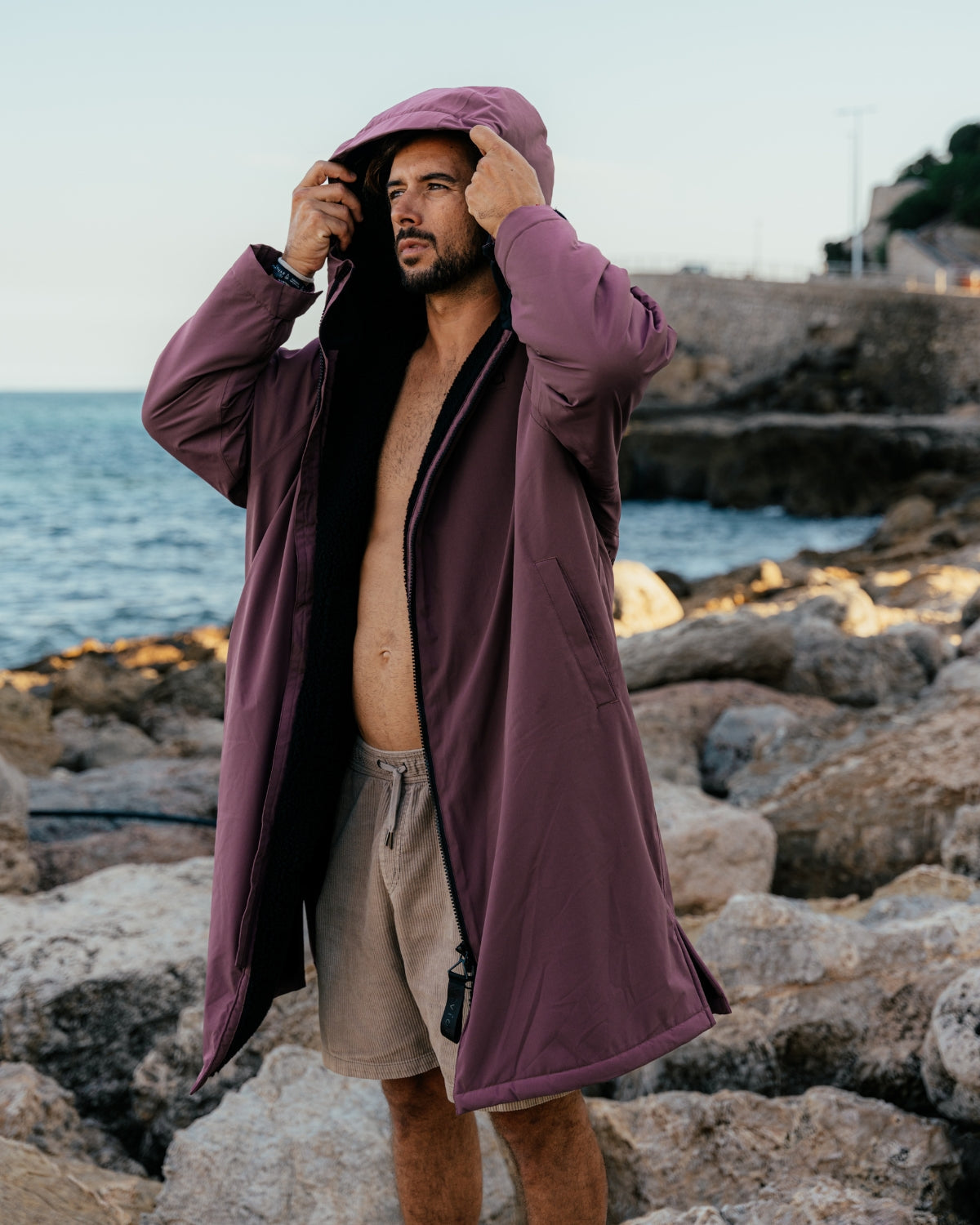 Lead_men - Man wearing a Vivida sherpa weatherproof changing robe Purple Dusky Damson