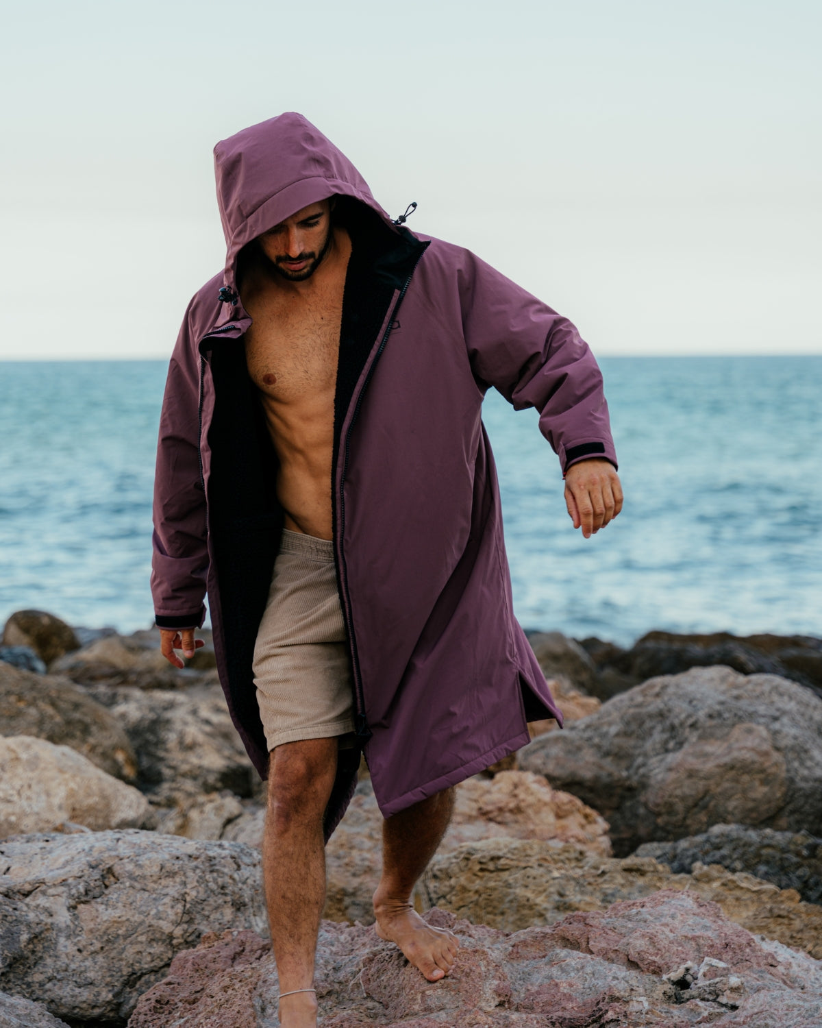 Lead_men2 - man wearing a Vivida sherpa weatherproof changing robe Purple Dusky Damson