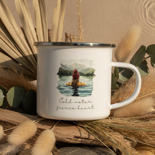 Enamel mug with a design of a person in water and mountains, text &