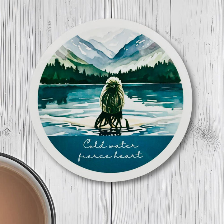 Cold Water, Fierce Heart Round Coaster – Wild Swimmer in Lake with Bobble Hat (Blonde or Brunette) | Outdoor Swim Décor