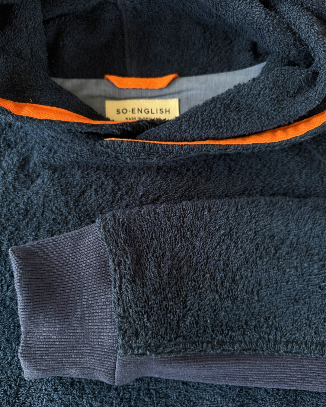 Navy So English Hampstead hoodie with a relaxed fit, showing the neckline and soft fabric on a plain background.