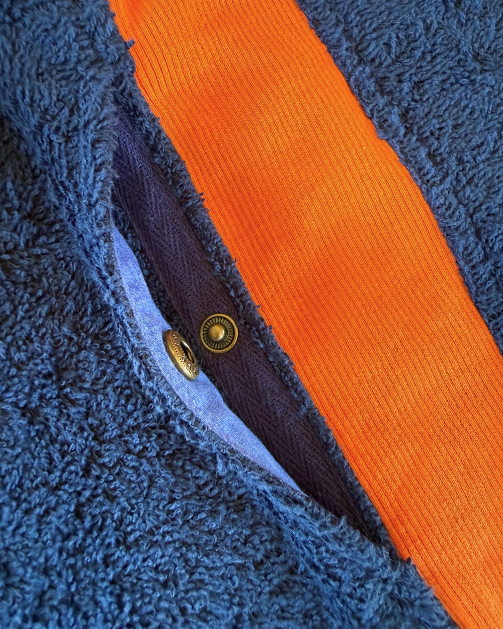Bright Brighton Blue and orange long hoodie by So English with popper details, casual beachwear style.
