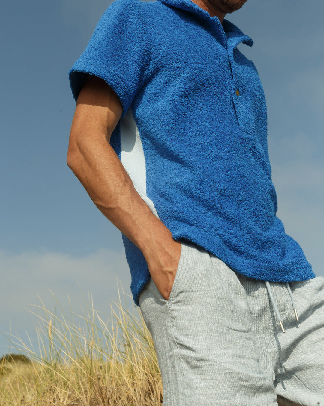 So English Brighton Blue Bond polo shirt, made in the UK, featuring a classic fit and vibrant blue color, displayed on a plain background.