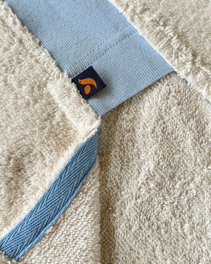Ecru and sky blue long hoodie by So English, featuring a relaxed fit and soft stretch fabric, perfect for casual beachwear.