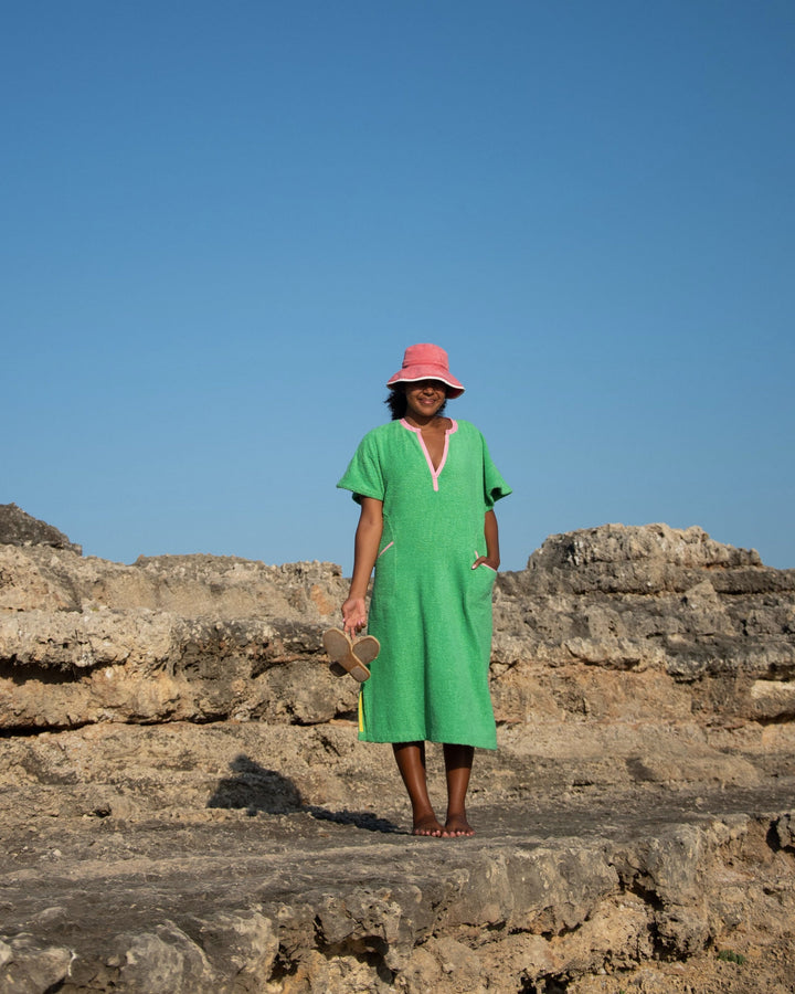 Long green dress by So English featuring a fresh, vibrant design, perfect for beachwear or casual summer outings.