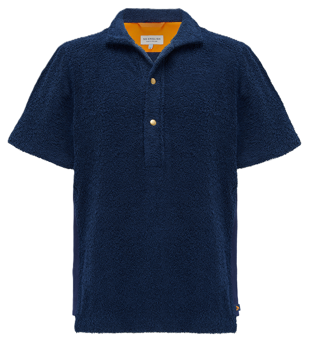 Navy Bond polo shirt by So English displayed on a hanger, showcasing a classic fit and soft cotton fabric.