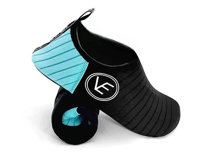 Side image of a pair of adult water shoes with black and aqua upper and black sole, featuring a distinctive VE logo.
