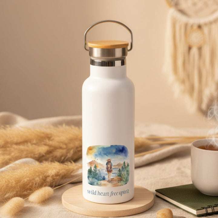 White water bottle with a scenic design and &