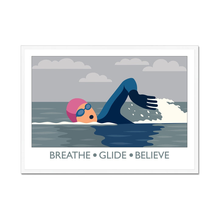 Framed wild swimming art print in white frame showing open water swimmer mid-stroke titled Breathe Glide Believe