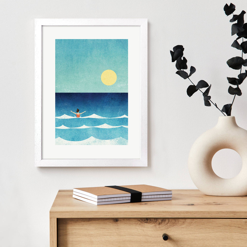 Dip in the Sea art print displayed in a white frame in a contemporary home setting.