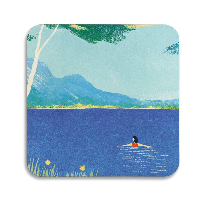 Lake Swimming coaster with an illustration by Henry Rivers featuring a lone swimmer in a blue lake with mountains and a tree in the background.
