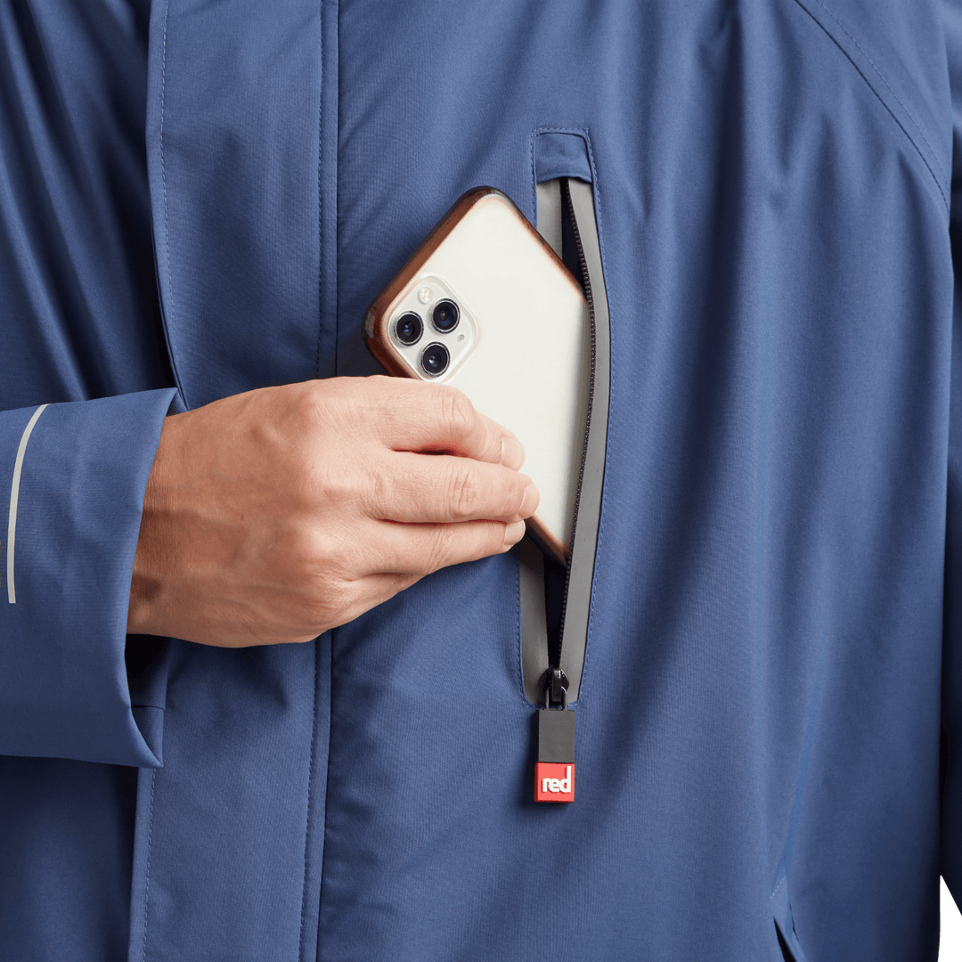Waterproof chest pocket on Red Alter Evo men’s long sleeve waterproof changing robe in Admiral Blue, ideal for storing your mobile phone.