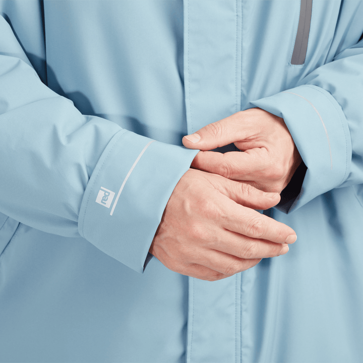 Adjustable cuff detail on Red Alter Evo men’s long sleeve waterproof changing robe in Alpine Blue.