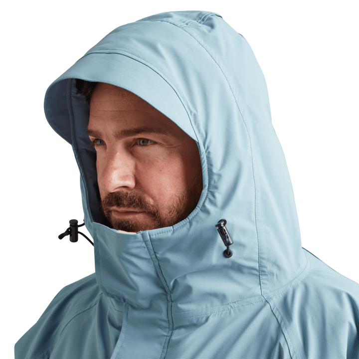 Peaked hood on Red Alter Evo men’s long sleeve waterproof changing robe in Alpine Blue.
