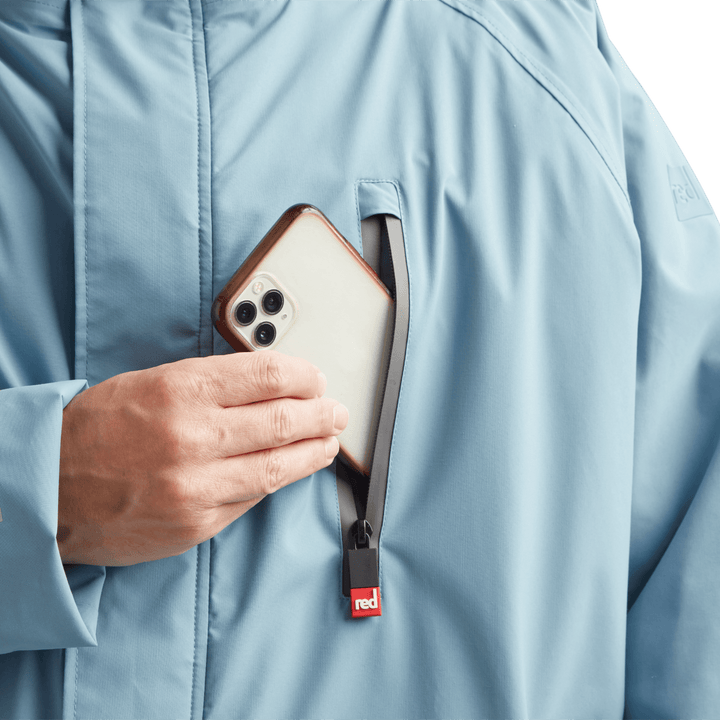 Waterproof chest pocket on Red Alter Evo men’s long sleeve waterproof changing robe in Alpine Blue, ideal for storing your mobile phone.
