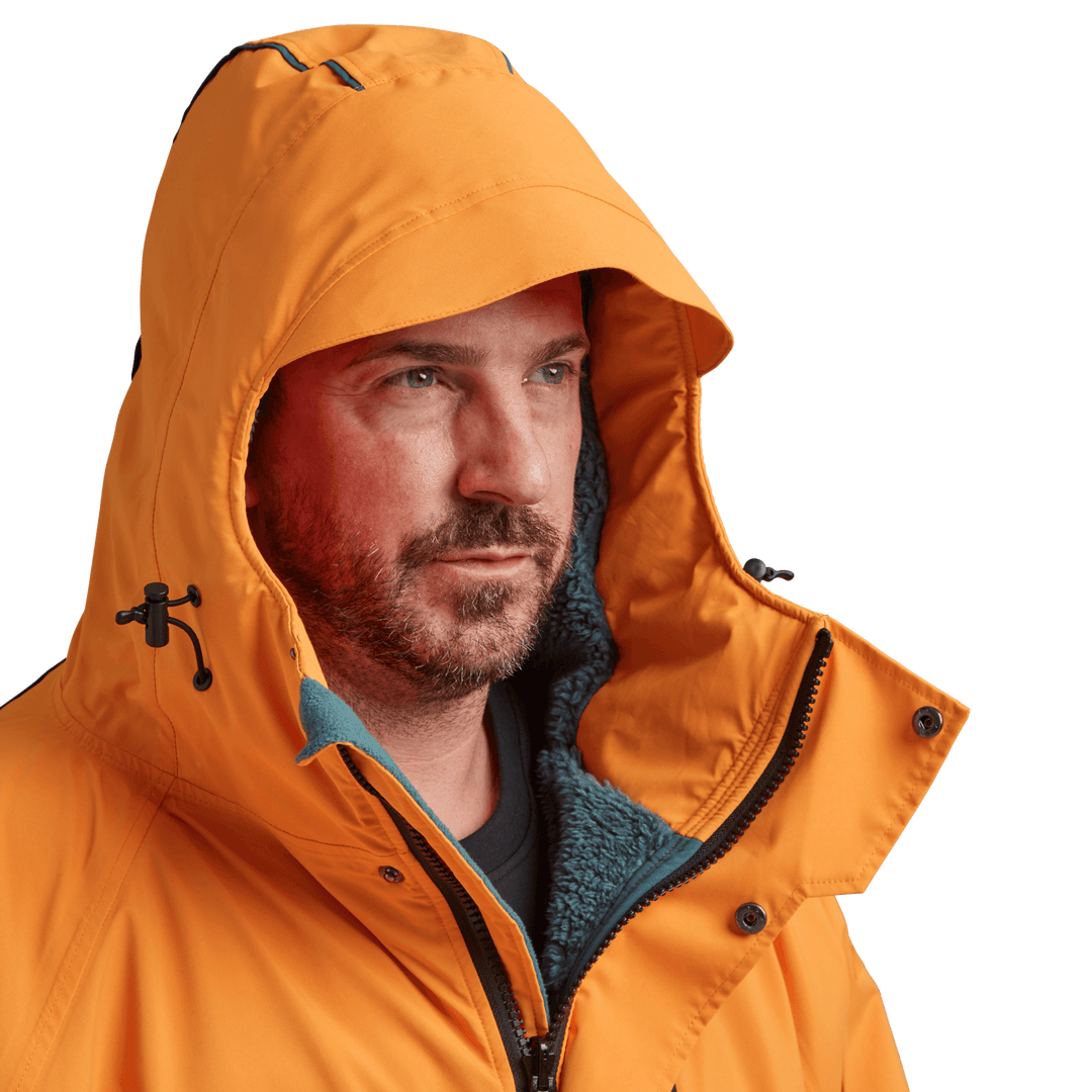 Peaked hood on Red Alter Evo men’s long sleeve waterproof changing robe in Bitter Orange.