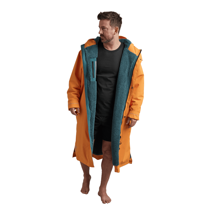 Interior view of Red Alter Evo men’s long sleeve waterproof changing robe in Bitter Orange showing the teal  coloured Sherpa fleece lining.