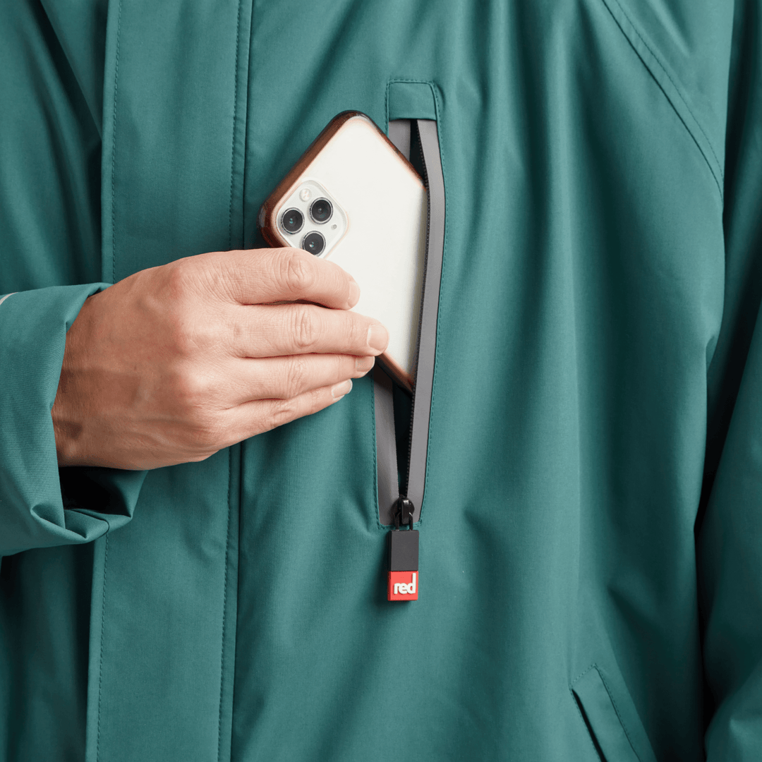 Waterproof chest pocket on Red Alter Evo men’s long sleeve waterproof changing robe in Deep Teal, ideal for storing your mobile phone.