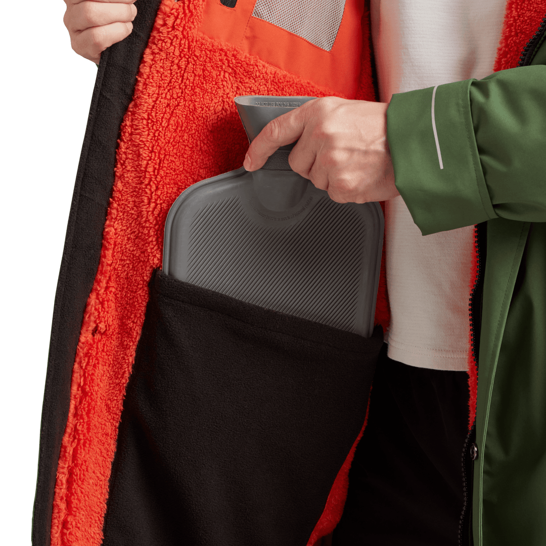 Large inside stash pocket, big enough to hold a hot water bottle, on Red Alter Evo men’s long sleeve waterproof changing robe in Forest Green.