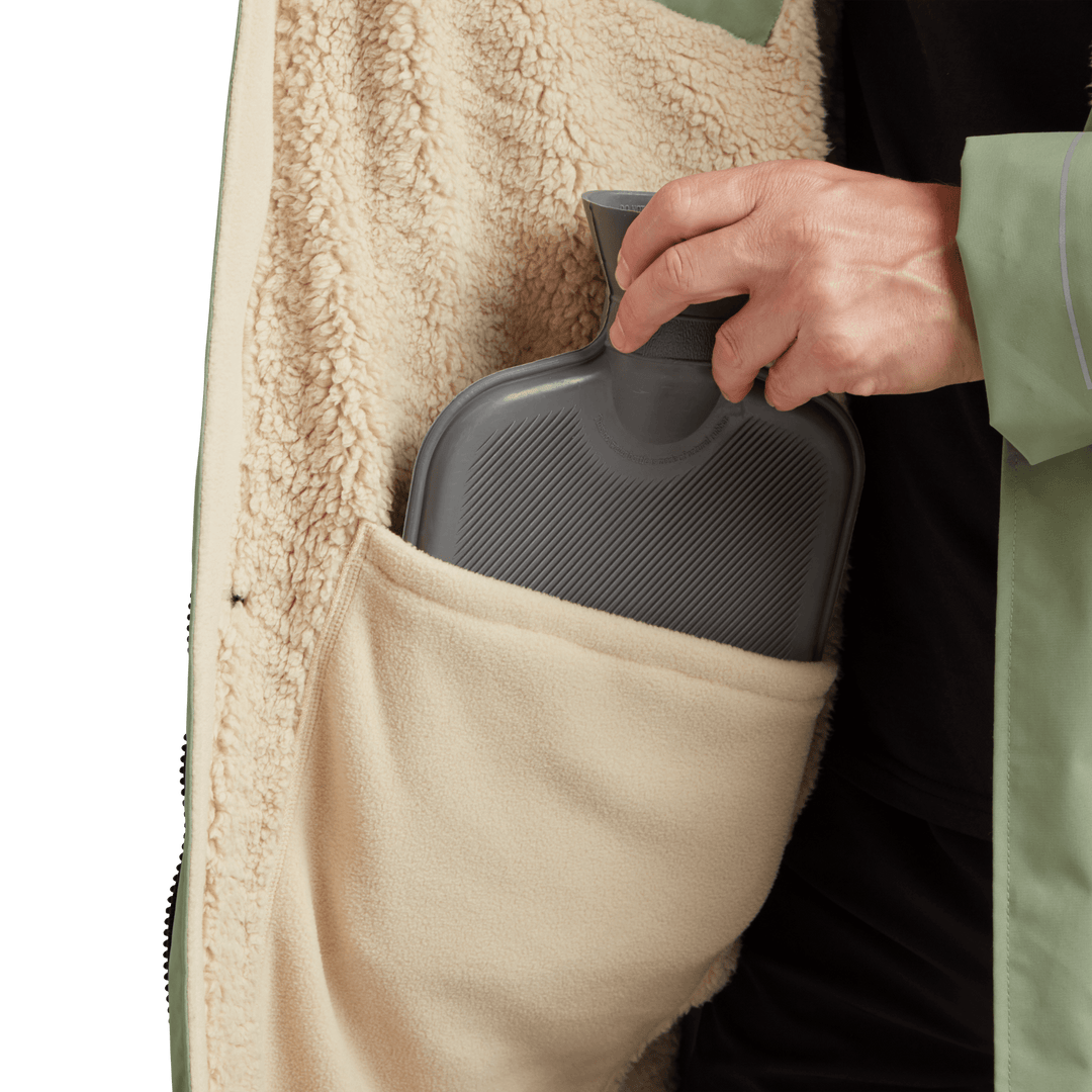 Large inside stash pocket, big enough to hold a hot water bottle, on Red Alter Evo men’s long sleeve waterproof changing robe in Sage Green.