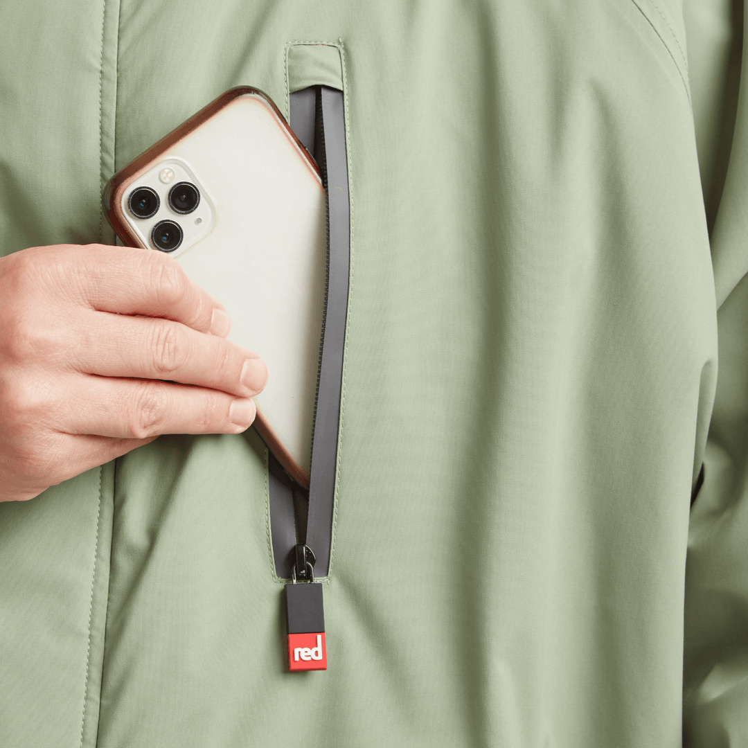 Waterproof chest pocket on Red Alter Evo men’s long sleeve waterproof changing robe in Sage Green, ideal for storing your mobile phone.