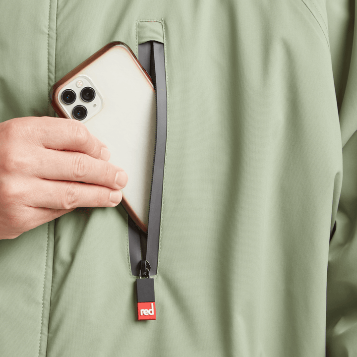 Waterproof chest pocket on Red Alter Evo men’s long sleeve waterproof changing robe in Sage Green, ideal for storing your mobile phone.