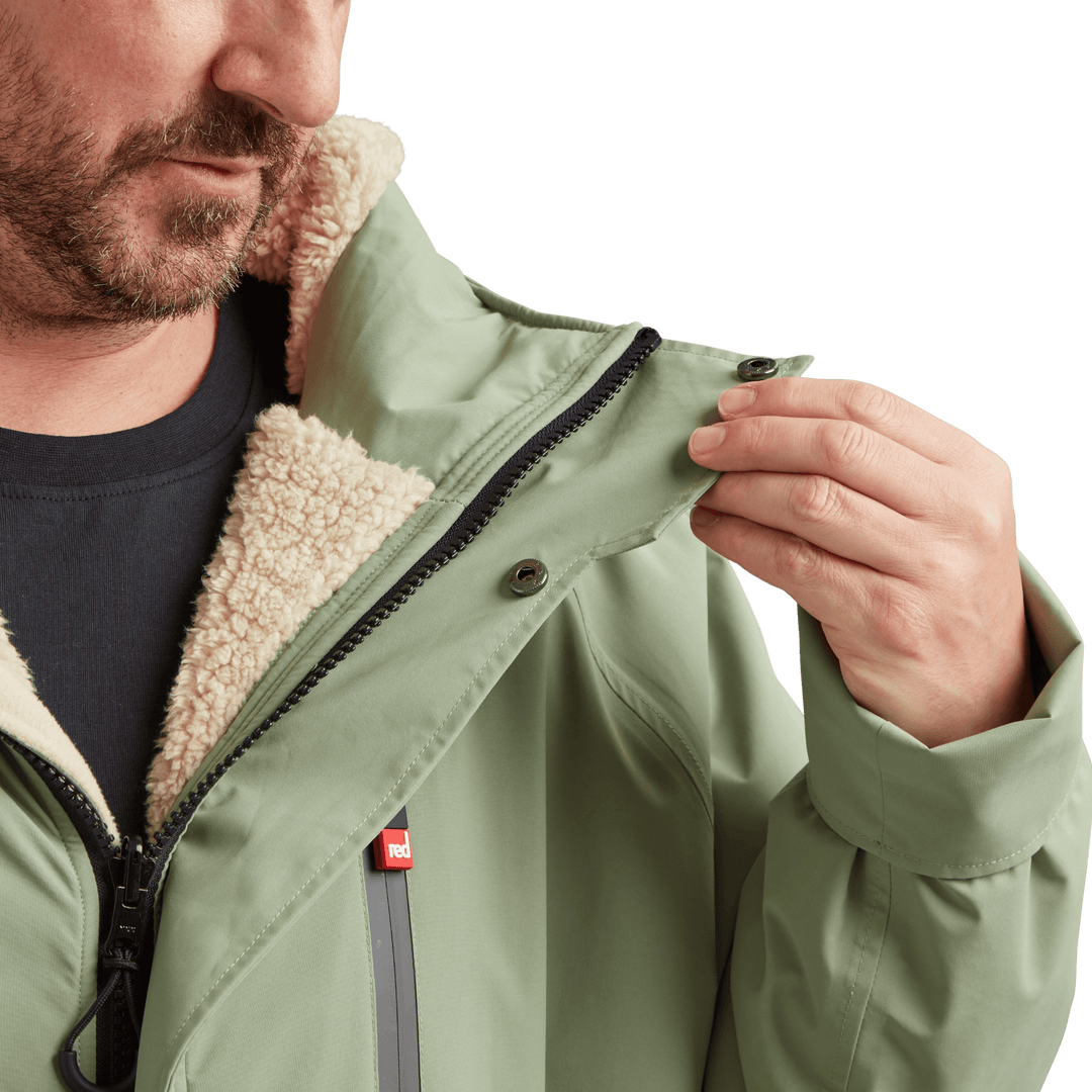 Two-way YKK zip with with easy-hold pulls and guard on Red Alter Evo men’s long sleeve waterproof changing robe in Sage Green.