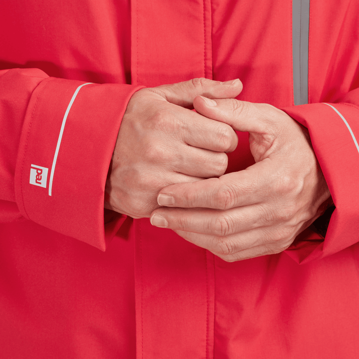 Adjustable cuff detail on Red Alter Evo men’s long sleeve waterproof changing robe in Siren Red.
