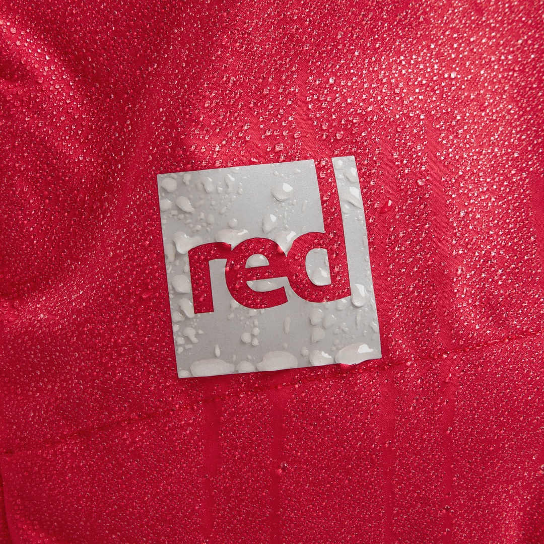 Red Equipment logo detail on Alter Evo men’s long sleeve waterproof changing robe in Siren Red.