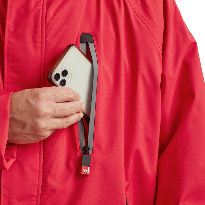 Waterproof chest pocket on Red Alter Evo men’s long sleeve waterproof changing robe in Siren Red, ideal for storing your mobile phone.