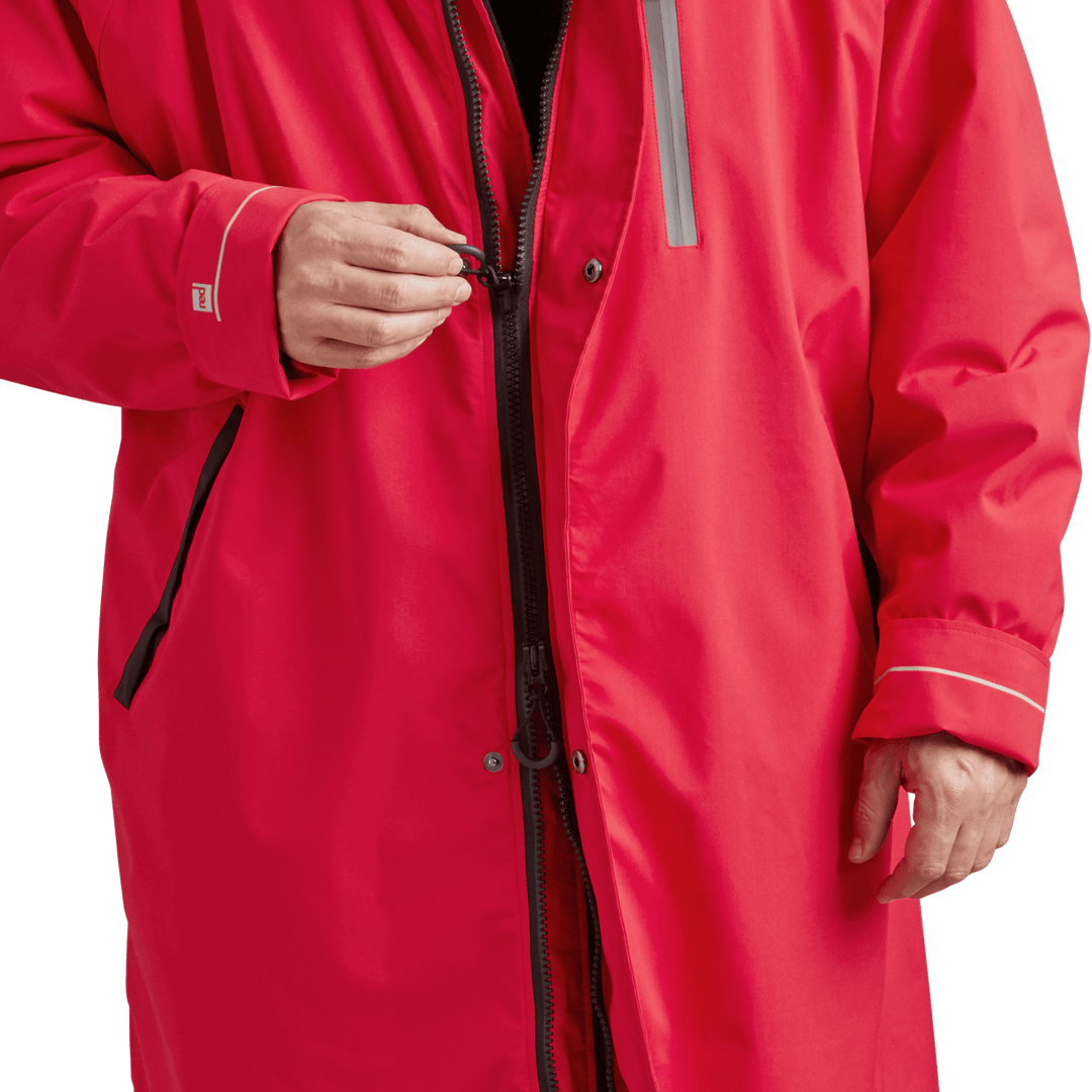 YKK two-way zip with easy-hold pulls on Red Alter Evo men’s long sleeve waterproof changing robe in Siren Red.