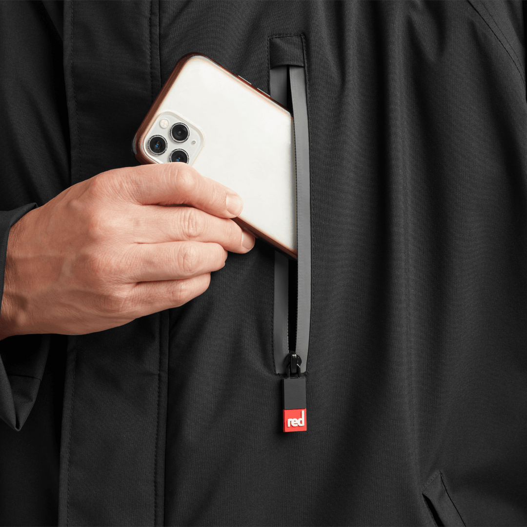 Waterproof chest pocket on Red Alter Evo men’s long sleeve waterproof changing robe in Stealth Black, ideal for storing your mobile phone.