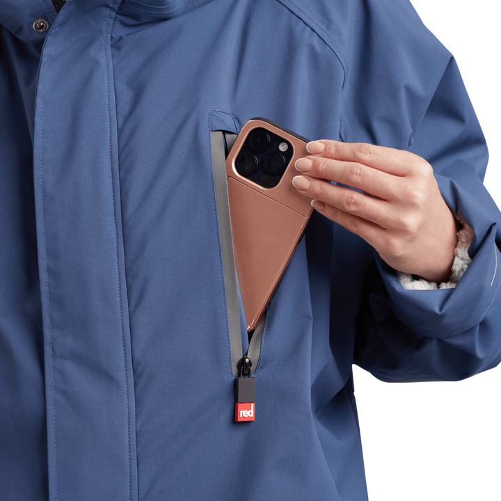 Waterproof chest pocket on Red Alter Evo women’s long sleeve waterproof changing robe in Admiral Blue, ideal for storing your mobile phone.