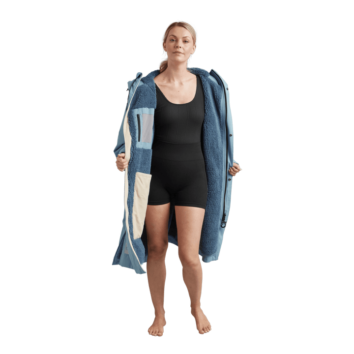 Interior view of Red Alter Evo women’s long sleeve waterproof changing robe in Alpine Blue with a blue Sherpa fleece lining.