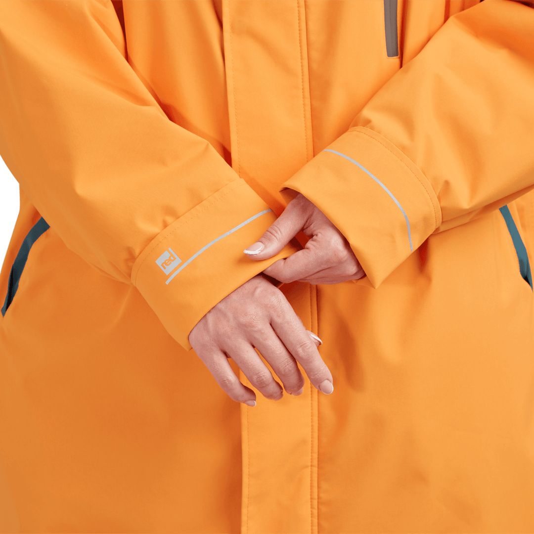 Adjustable cuff detail on Red Alter Evo women’s long sleeve waterproof changing robe in Bitter Orange.
