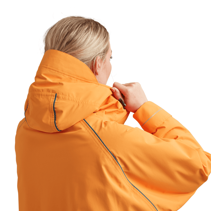 Back view of peaked hood on Red Alter Evo women’s long sleeve waterproof changing robe in Bitter Orange.
