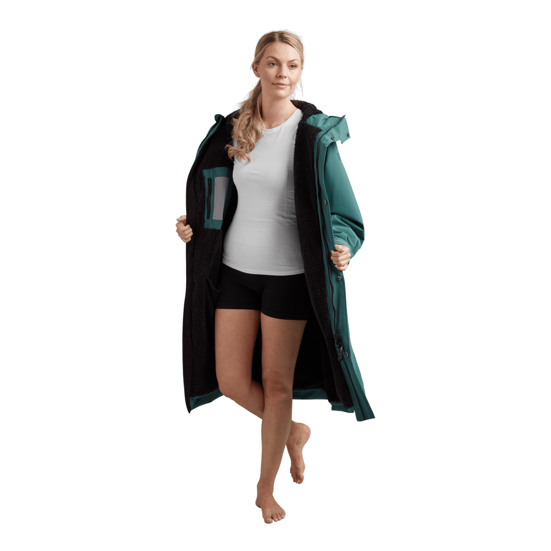 Interior view of Red Alter Evo women’s long sleeve waterproof changing robe in Deep Teal showing the black  Sherpa fleece lining.