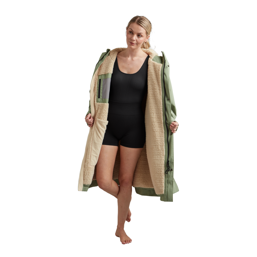 Interior view of Red Alter Evo women’s long sleeve waterproof changing robe in Sage Green showing the cream Sherpa fleece lining.