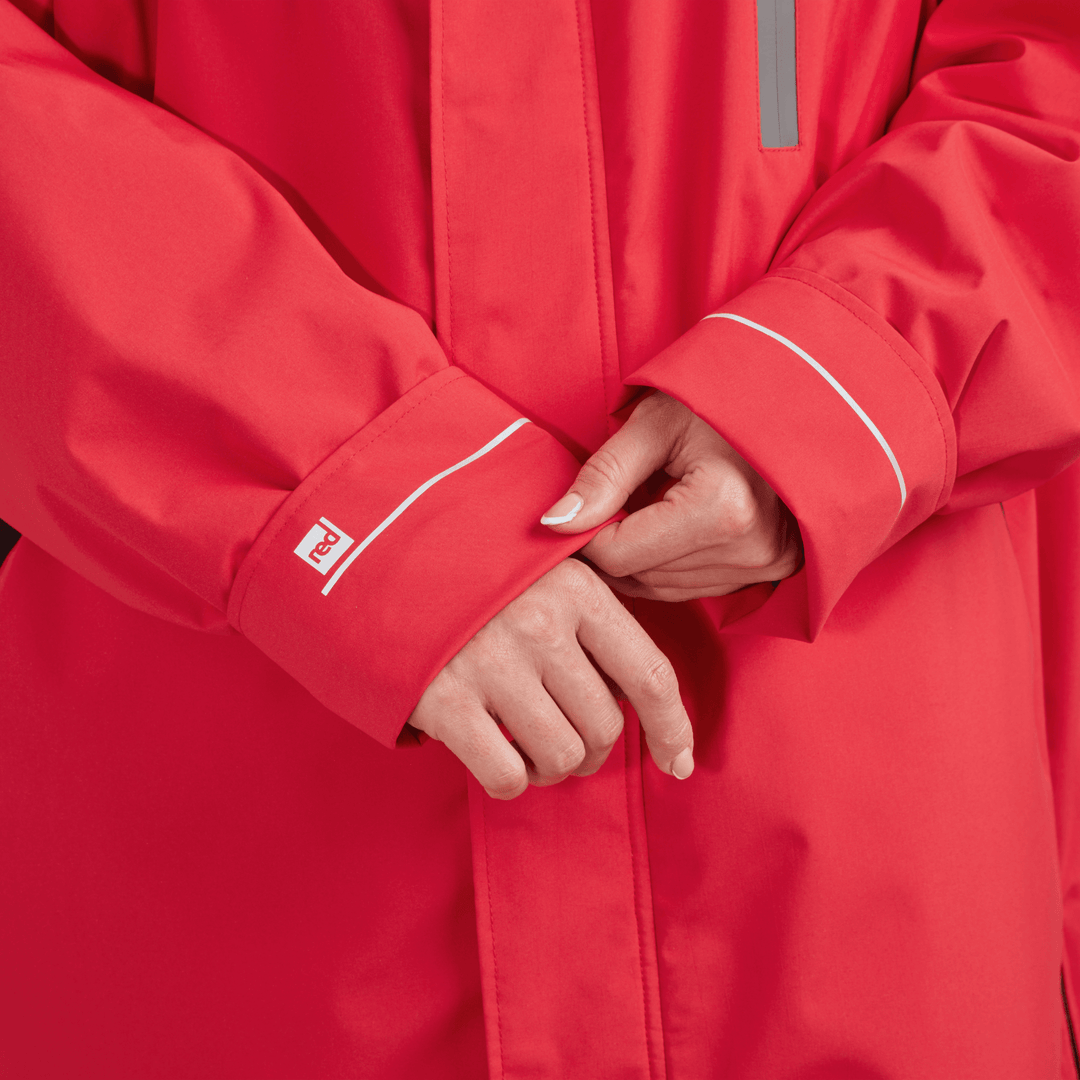 Adjustable cuff detail on Red Alter Evo women’s long sleeve waterproof changing robe in Siren Red.
