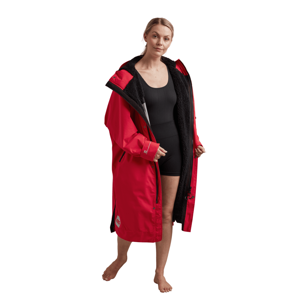 Interior view of Red Alter Evo women’s long sleeve waterproof changing robe in Siren Red showing the black Sherpa fleece lining.