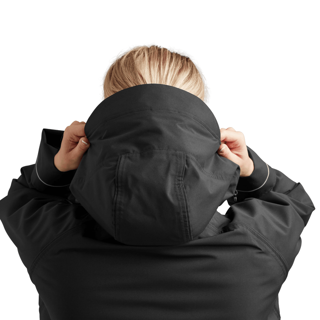 Back view of peaked hood on Red Alter Evo women’s long sleeve waterproof changing robe in Stealth Black.
