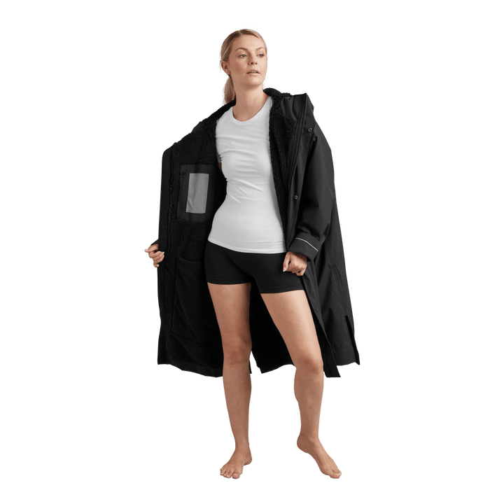 Interior view of Red Alter Evo women’s long sleeve waterproof changing robe in Stealth Black showing the black Sherpa fleece lining.