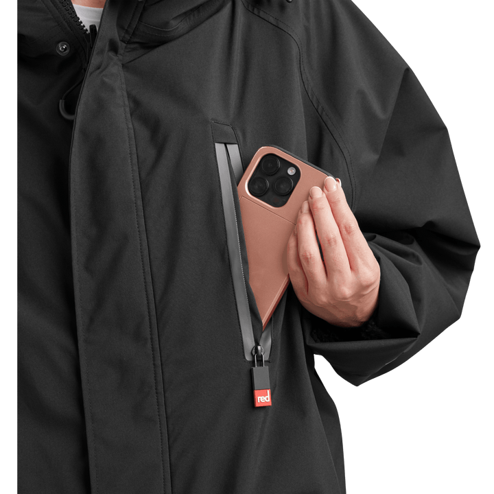 Waterproof chest pocket on Red Alter Evo women’s long sleeve waterproof changing robe in Stealth Black, ideal for storing your mobile phone.