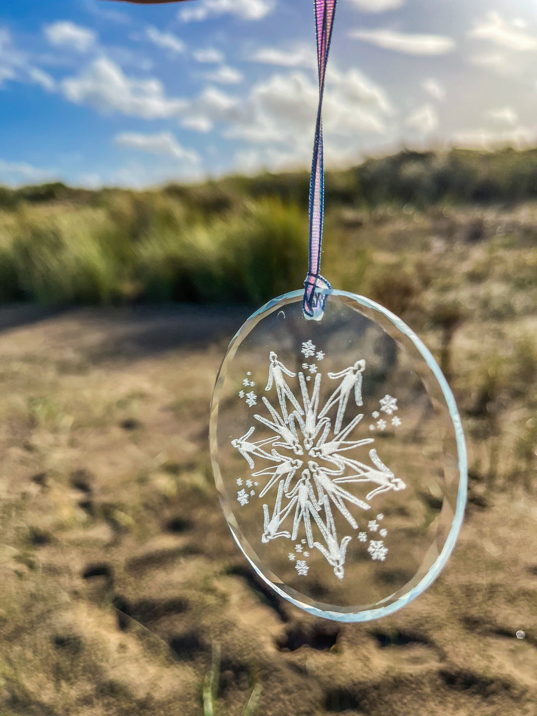 Glass Christmas decoration with synchronized swimmer snowflake design – unique festive ornament for wild swimmers.