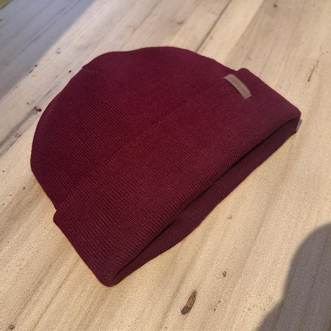 Swimbler Burgundy Waterproof Beanie with embossed logo and triple-layer waterproof protection, ideal for cold weather and open-water use.
