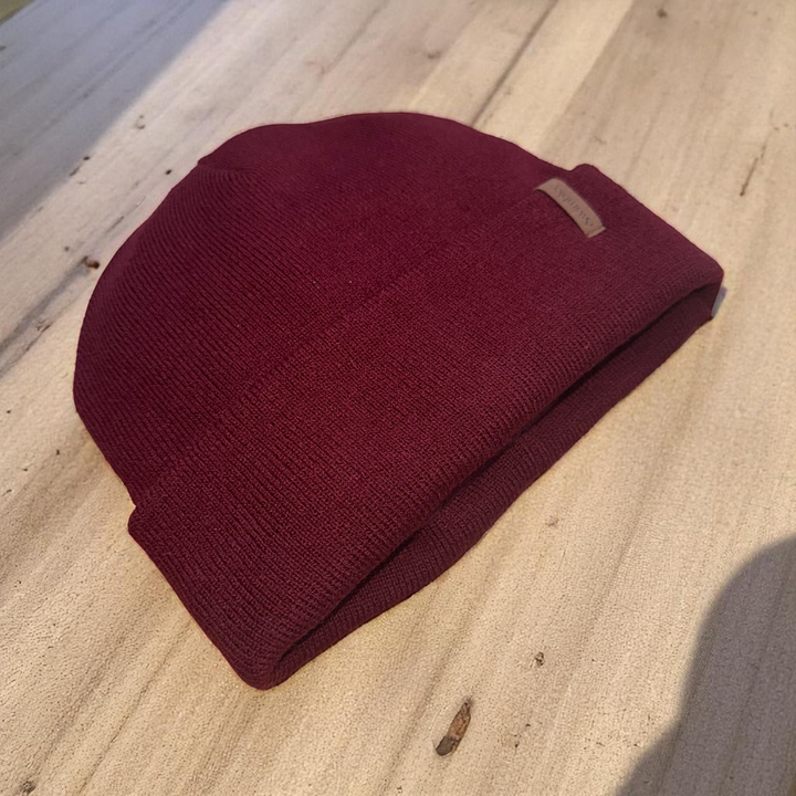 Swimbler Burgundy Waterproof Beanie with embossed logo and triple-layer waterproof protection, ideal for cold weather and open-water use.
