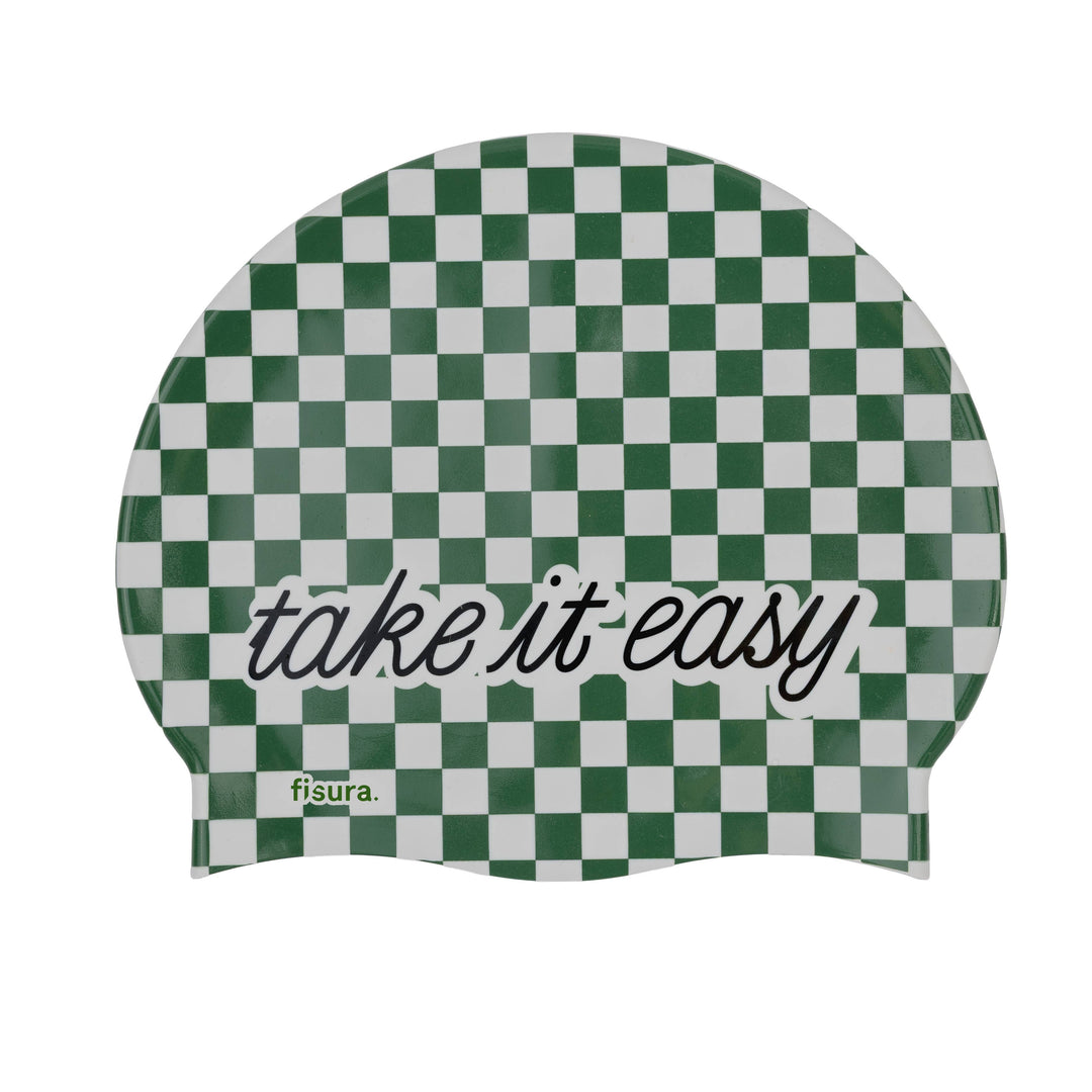 A green and white checkered swim cap with the words &