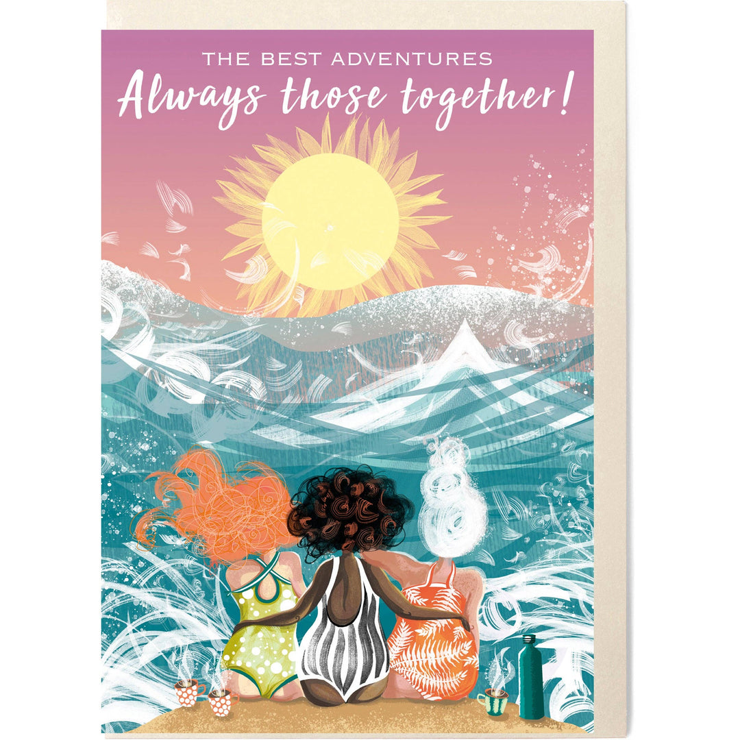Wild Sea, Cuppa Tea friendship card with a colourful illustration of three wild swimming friends sitting together by the sea with a steaming cuppa tea